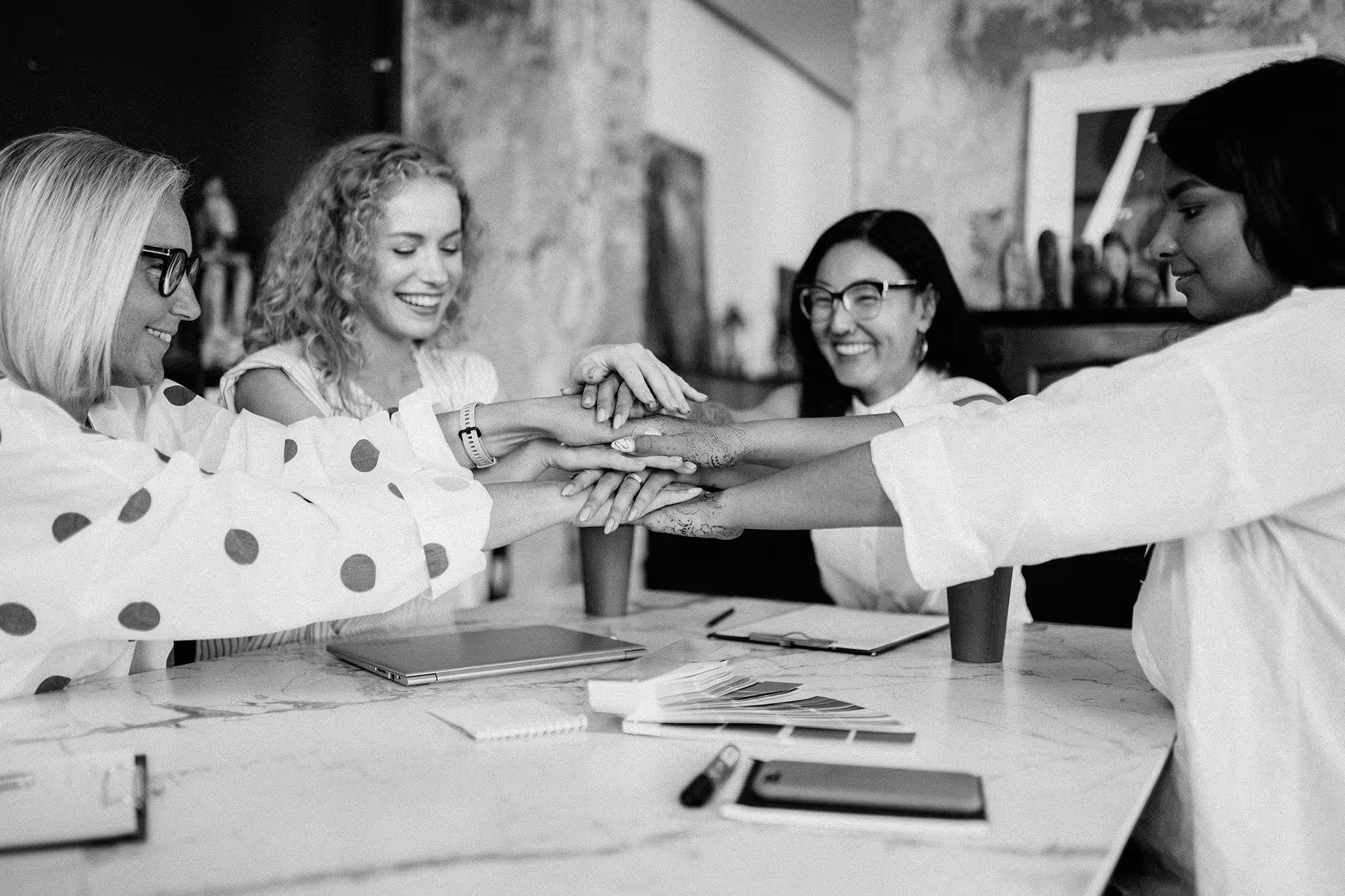 Blog post thumbnail: Beyond Marketing - Women collaborating around table