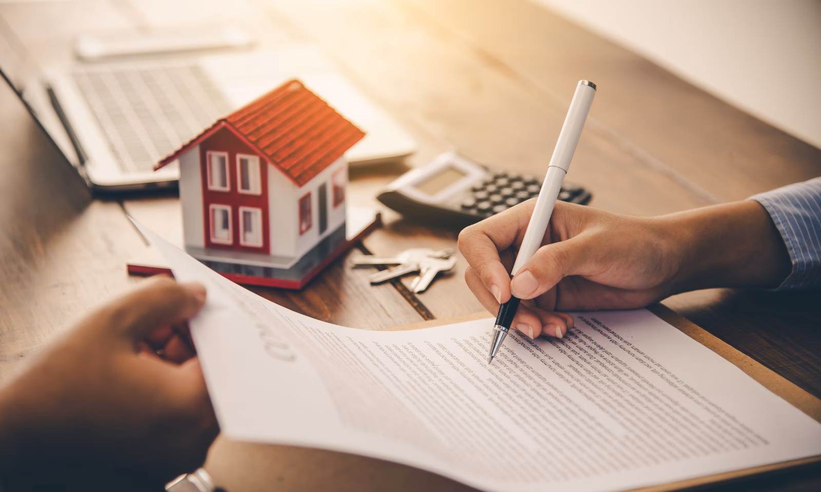 Mortgage playbook cover image - Person signing mortgage papers representing email marketing opportunities for mortgage companies